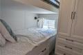 Bedroom in  Sans Souci cottage model at Wye Cottages in Midland Ontario
